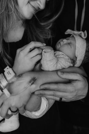Mother holding newborn for Fresh 48 photography session captured by Maryland Fresh 48 newborn photographer Mallory Bramlett.