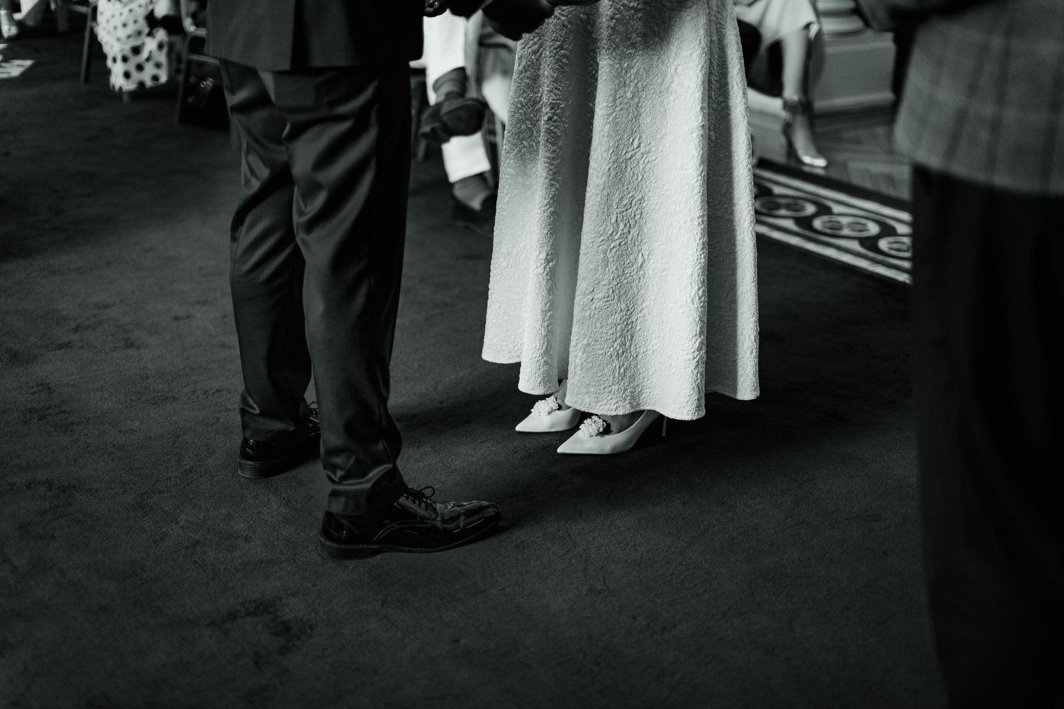 Photo of bride's white shoes