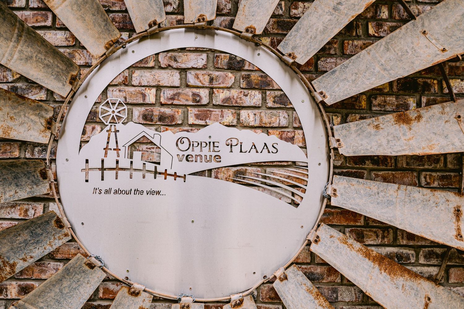 A series of vintage brick archways with white painted text and architectural details along the curved ceiling.