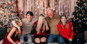 Family holiday photos arranged in a row showing festive outfits against rustic wooden backdrop.