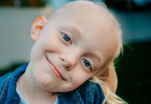Four close-up portrait shots showing bright blue eyes and gentle expressions.