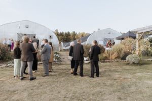 Guests mingling during cocktail hour at Farmer Brown's Greenhouse, fall October outdoor wedding in Moncton New Brunswick