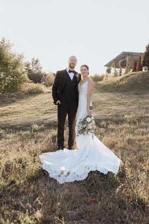 Bride and groom golden hour portraits in New Brunswick with sun setting behind them, elegant fall wedding photography, Moncton photographer