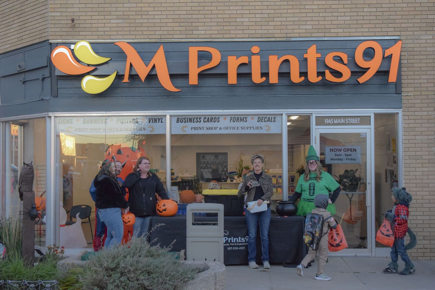 M Prints91 storefront signage displayed on a commercial building exterior.