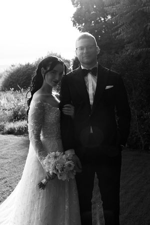 Black and white portraits of wedding couple in a natural outdoor setting at sunset.