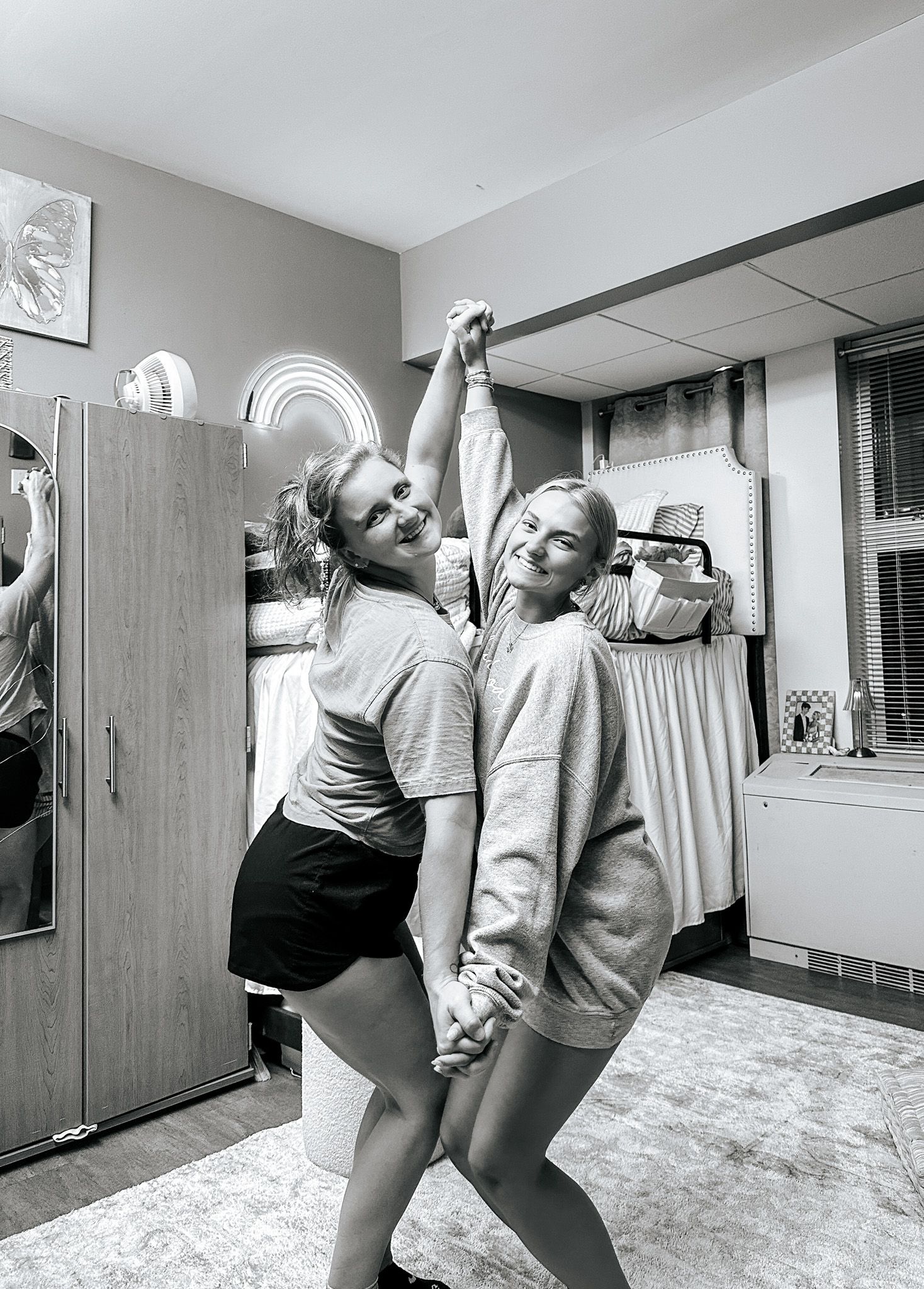 Black and white photos showing people dancing and having fun in an indoor space.