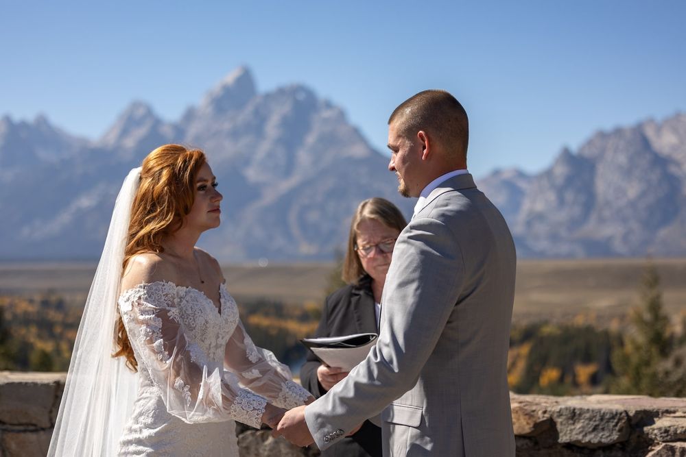 Newlyweds celebrate their wedding day against the stunning backdrop of the Grand Tetons in Wyoming.