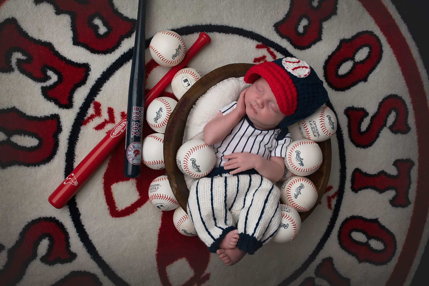 Baseball-themed blanket with red and white patterns.