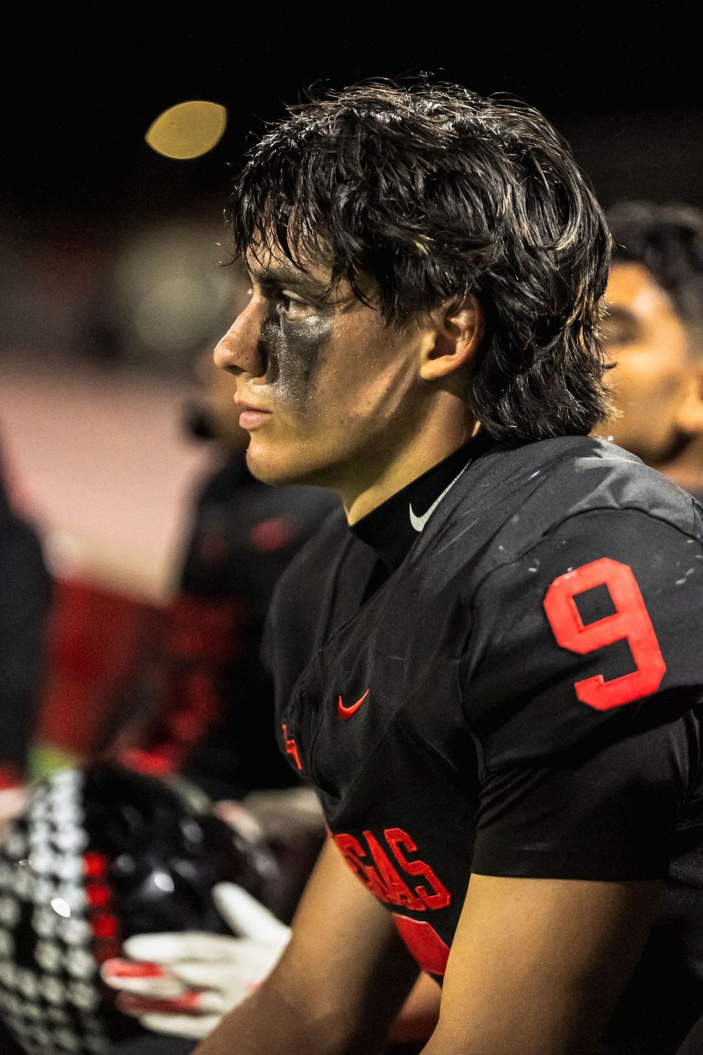 Football player looking off left frame