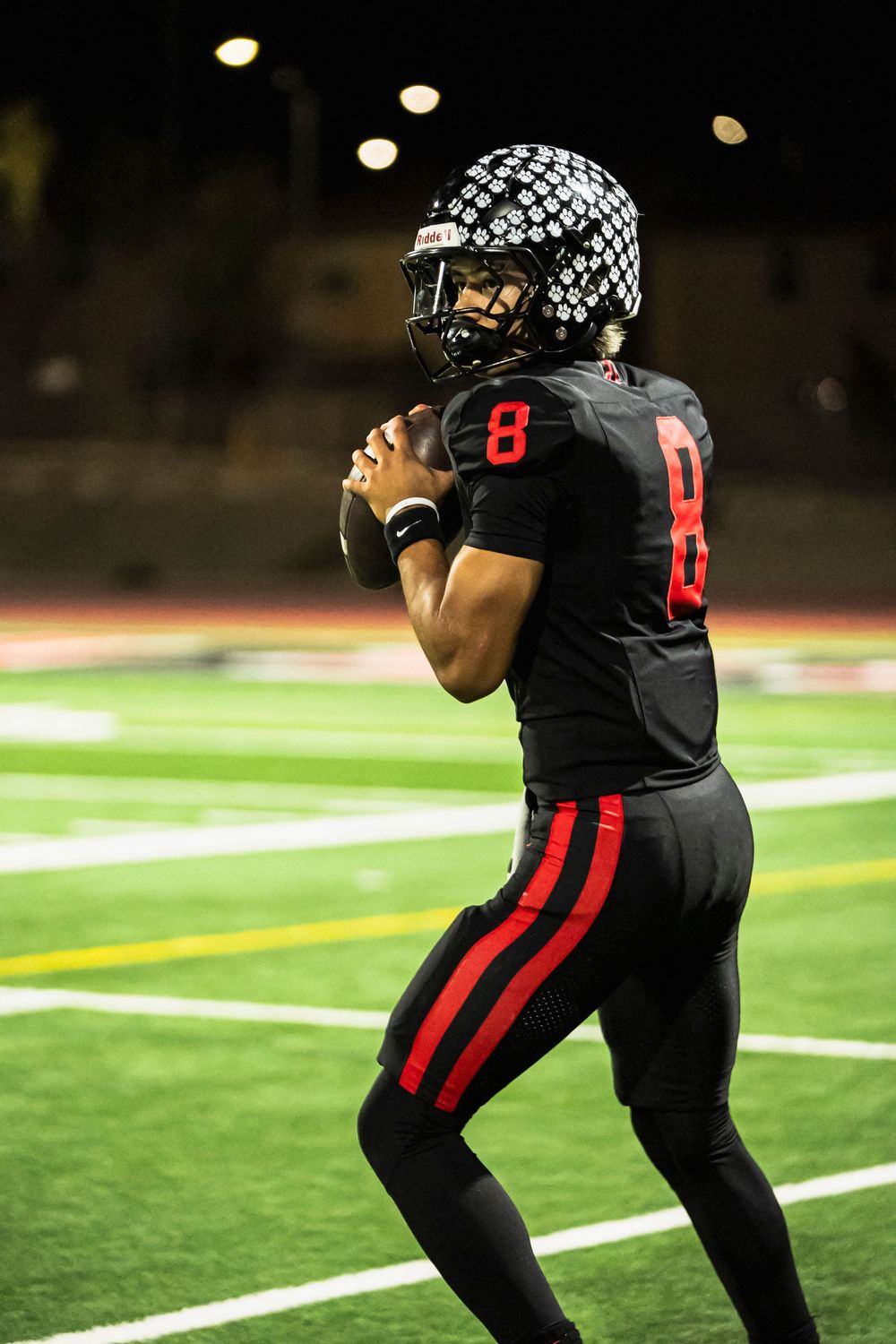 Football player prepping to throw a football