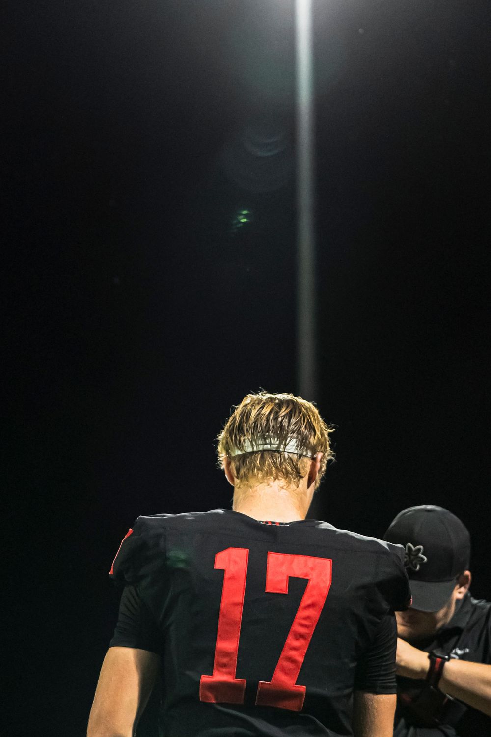 Football player talking to someone