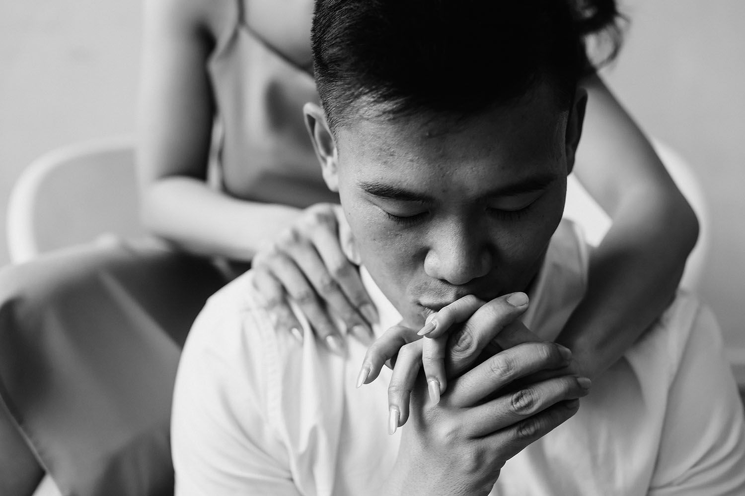 Black and white photo collage showing four emotional expressions from contemplative to distressed.