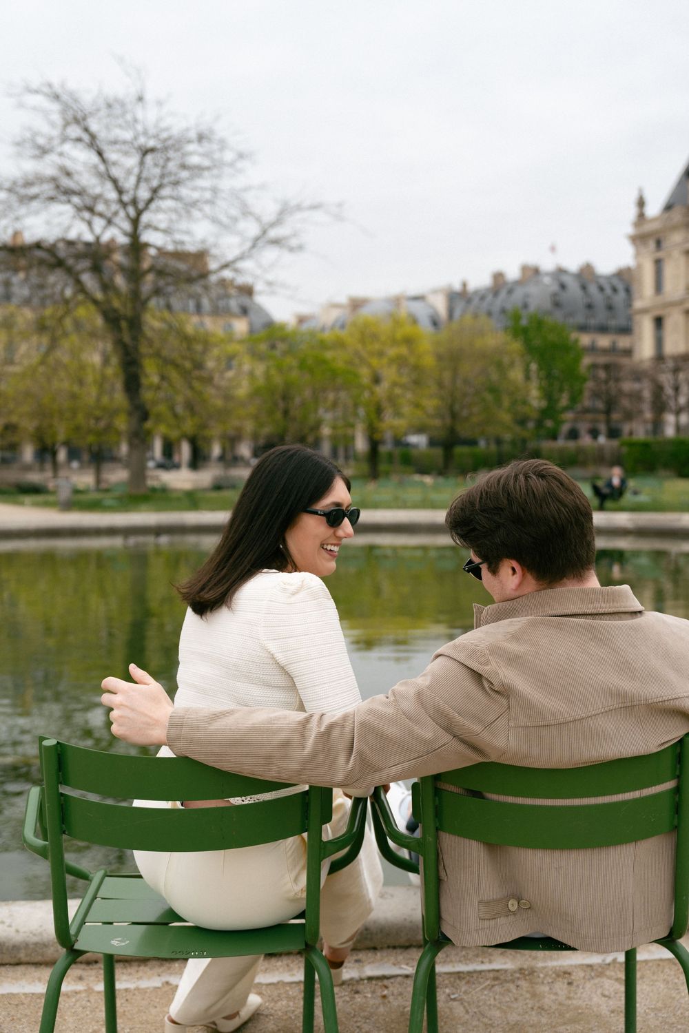 Paris engagement photo locations at Jardins des Tuileries, english speaking photographer, cherry blossoms, film photography