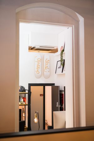 Modern office interior with arched doorways and ambient lighting creating architectural interest.