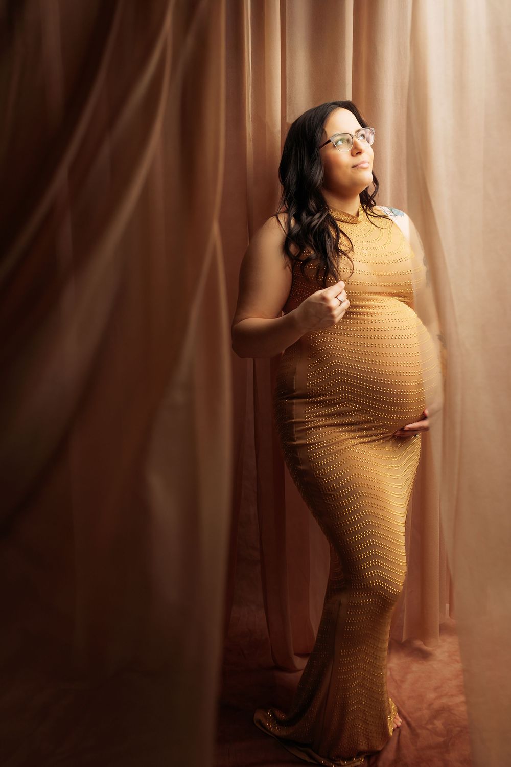 A series of artistic portraits showing a figure in a beige turtleneck sweater posing gracefully against a warm-toned backdrop.