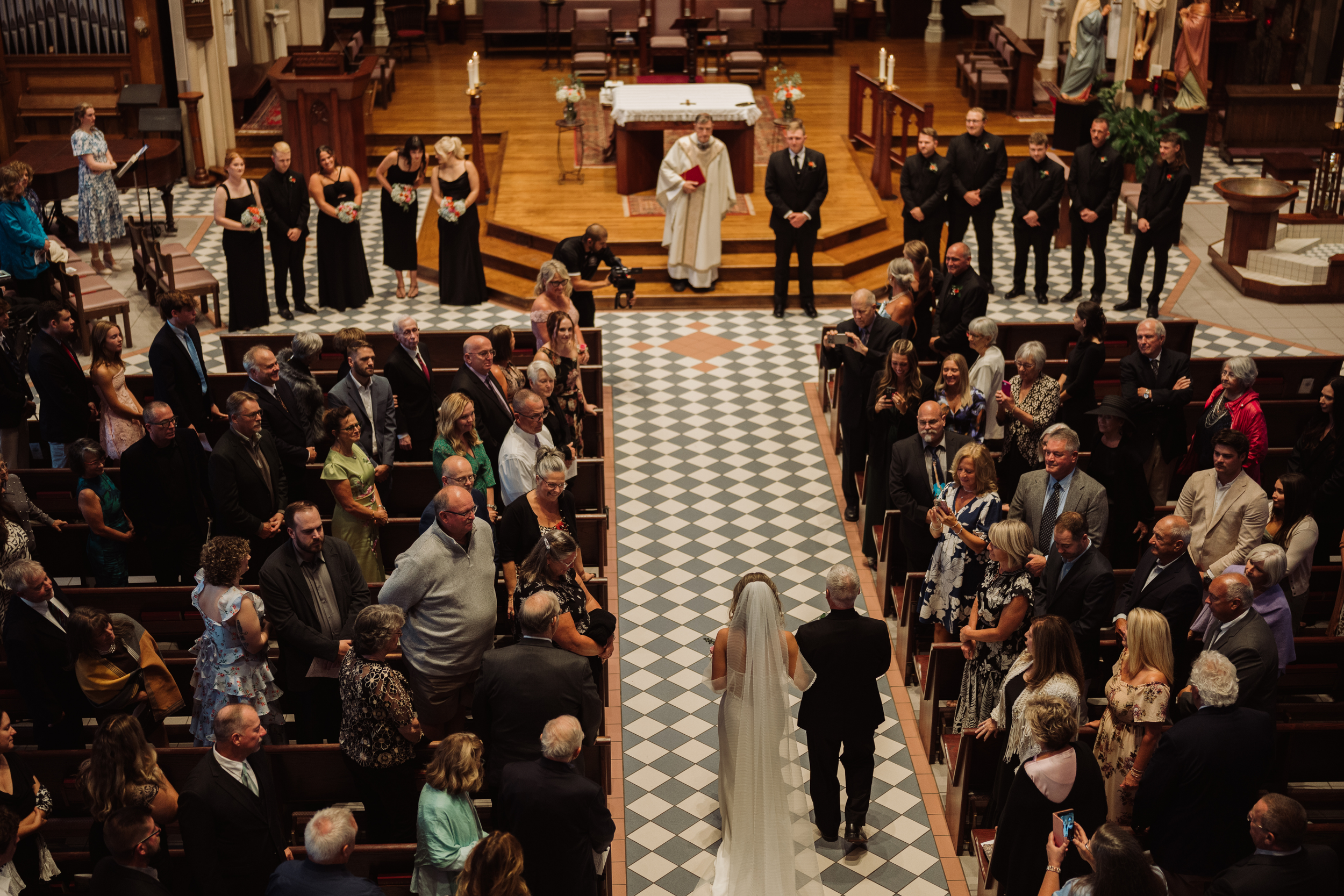 Bride walking down the aisle at St. Mary's Church in Auburn NY