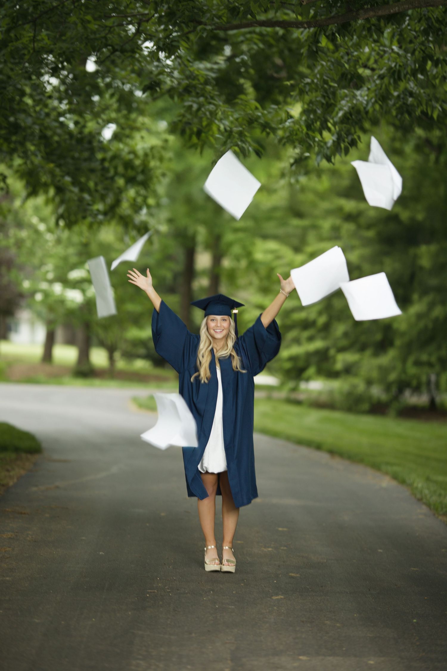 Senior cap and gown celebratory portrait in Wentzville MO by MJoy Photos