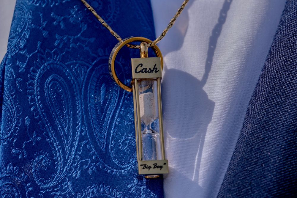 Vintage keys and decorative elements hanging against a blue patterned background.
