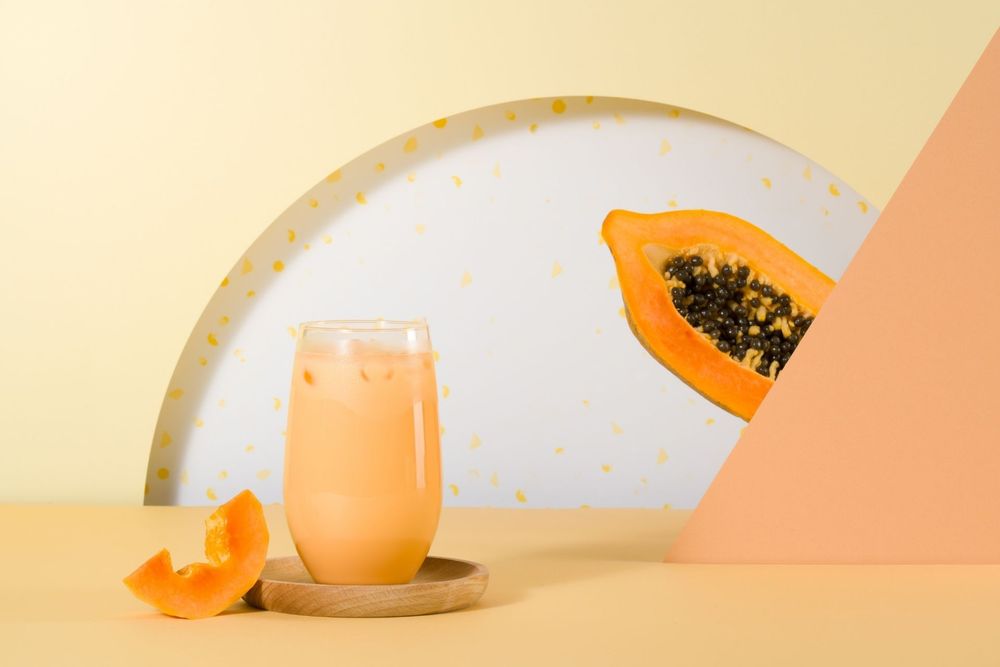 A sequence of orange and white circular shapes arranged in a minimalist pattern against a light background.