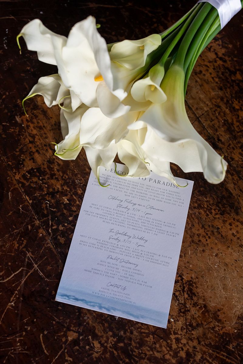 Bridal bouquet and invitation flat lay wedding details Cancun.