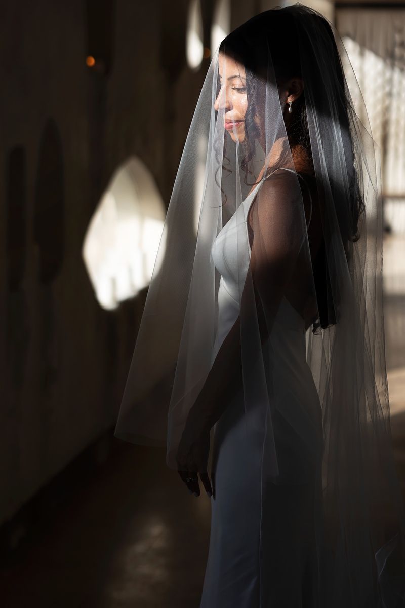Bride portrait with veil and soft light at Ilios Cancun.
