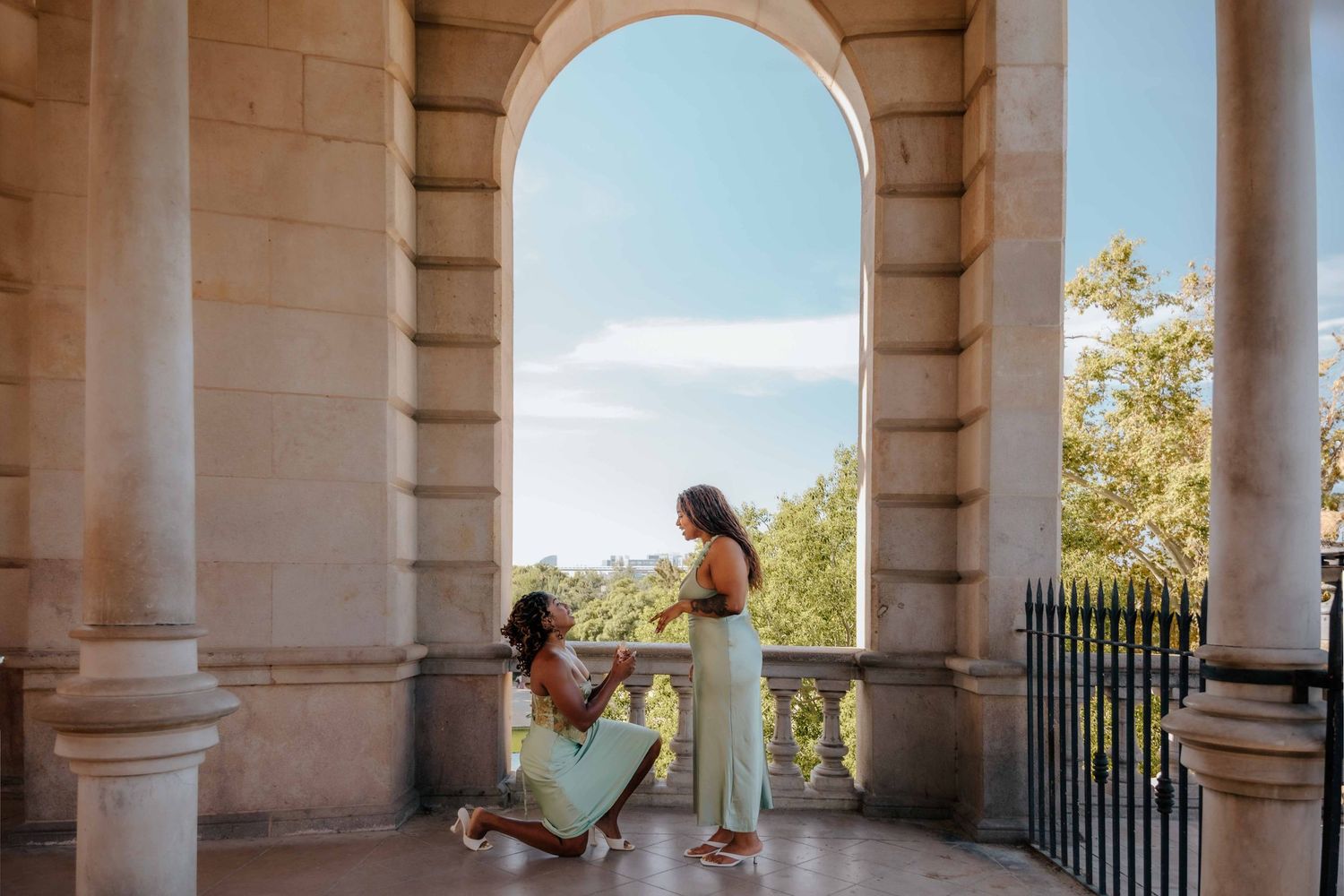 Romantic Barcelona proposal with fountain architecture in the background