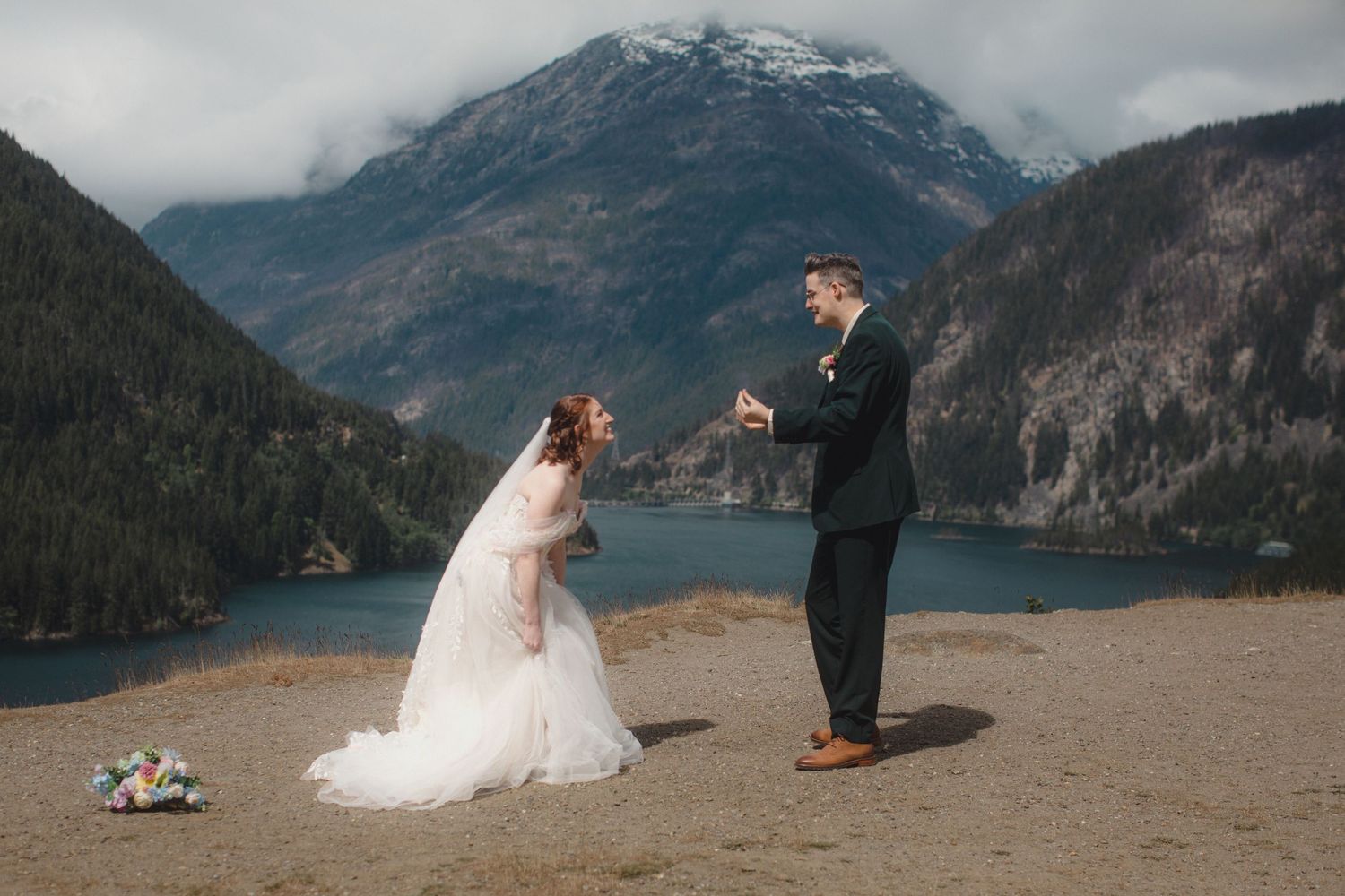 Couple elopes against a backdrop of the turquoise water of Diablo Lake in the North Cascades of Washington state.