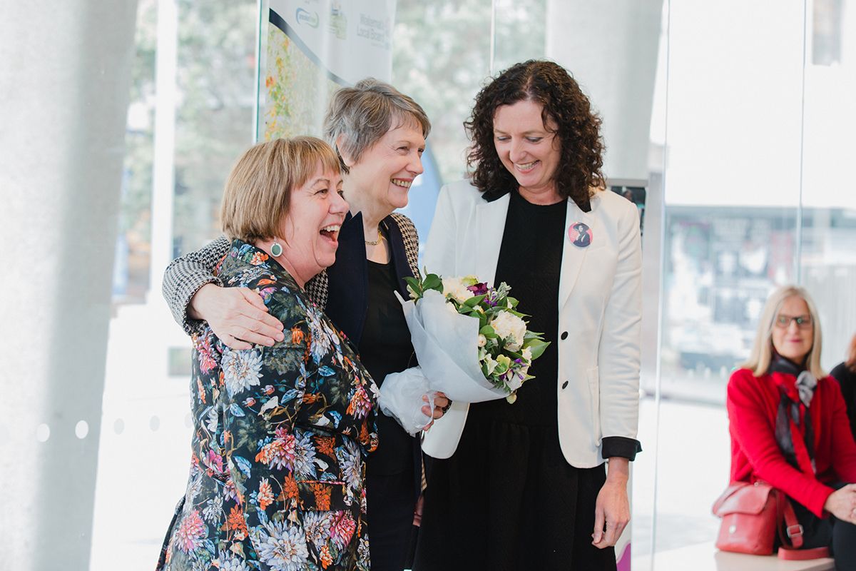 Candid photos of three women networking and interacting at a community event
