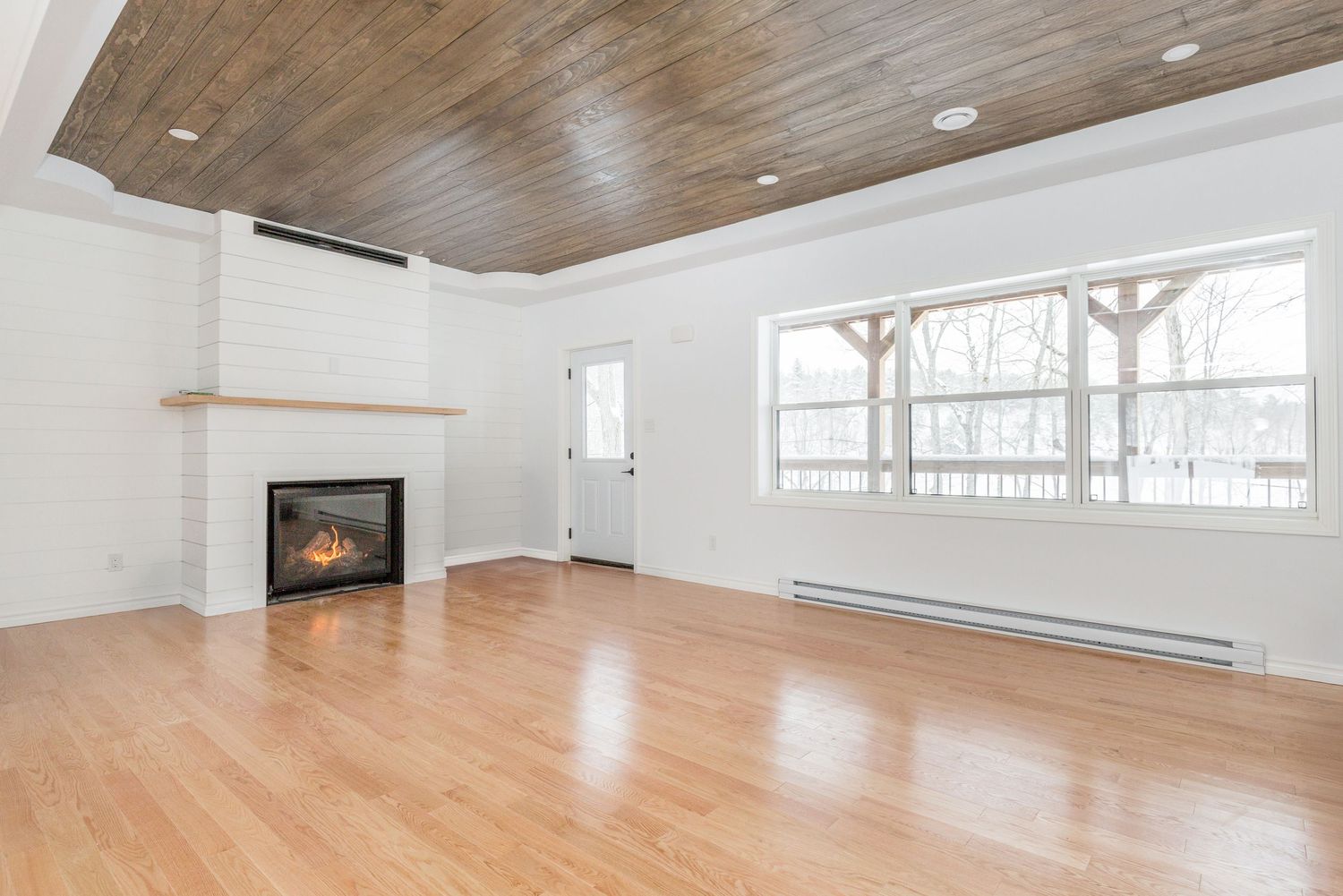 A photo of a vacant living room near Parry Sound Ontario for a real estate listing in Muskoka photographed by Sarah Tennant