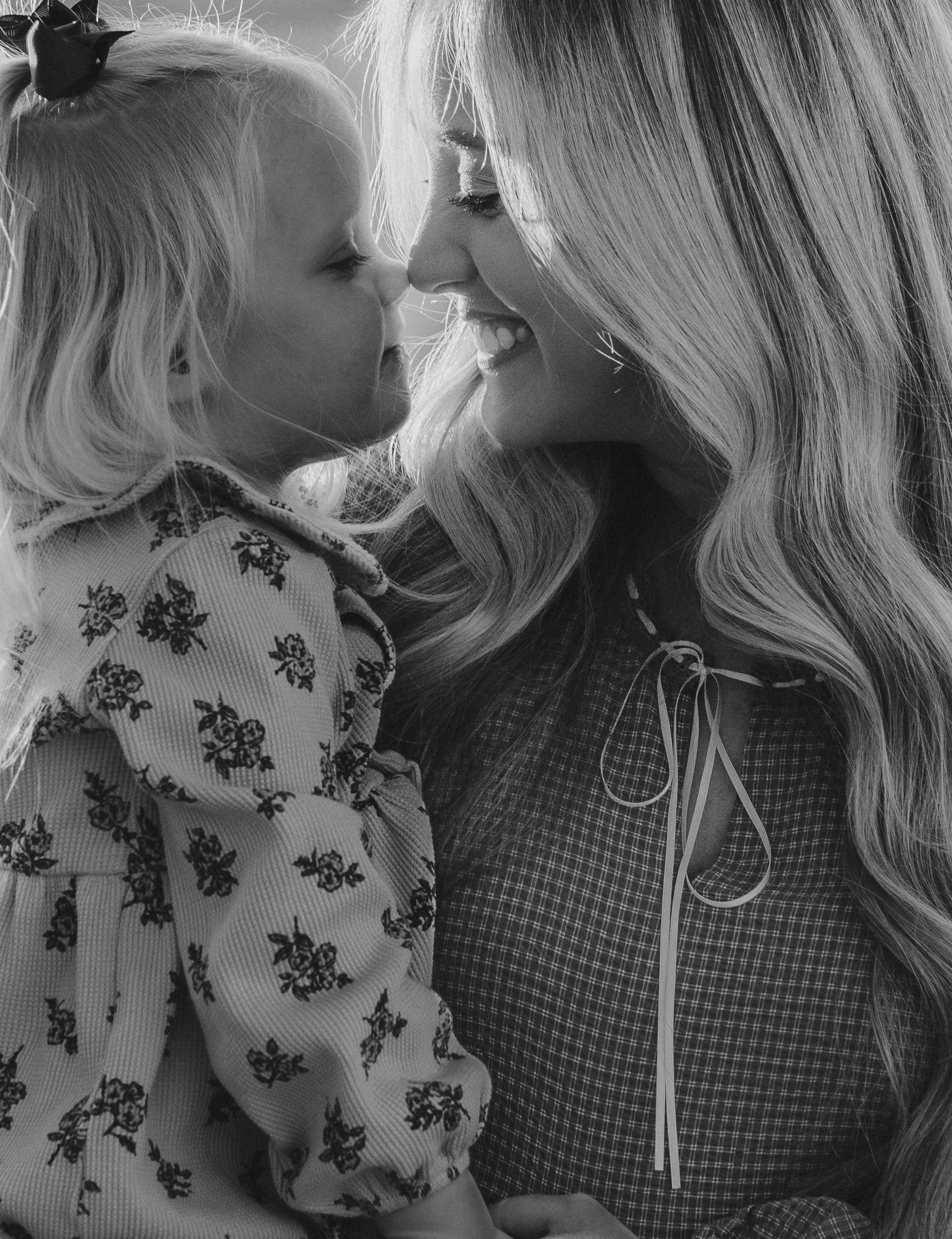 Sweet black and white portrait of intimate mother and child moment.