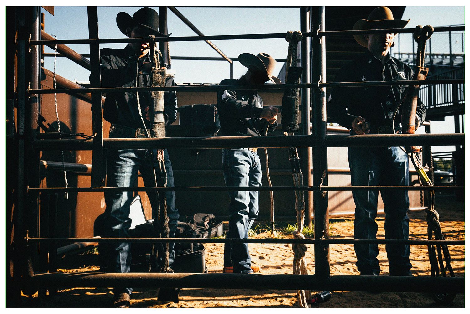 Professional Bull Riders preparing their bull ropes at an arena in Weatherford, Texas pre-event photographed by Chris Douglas