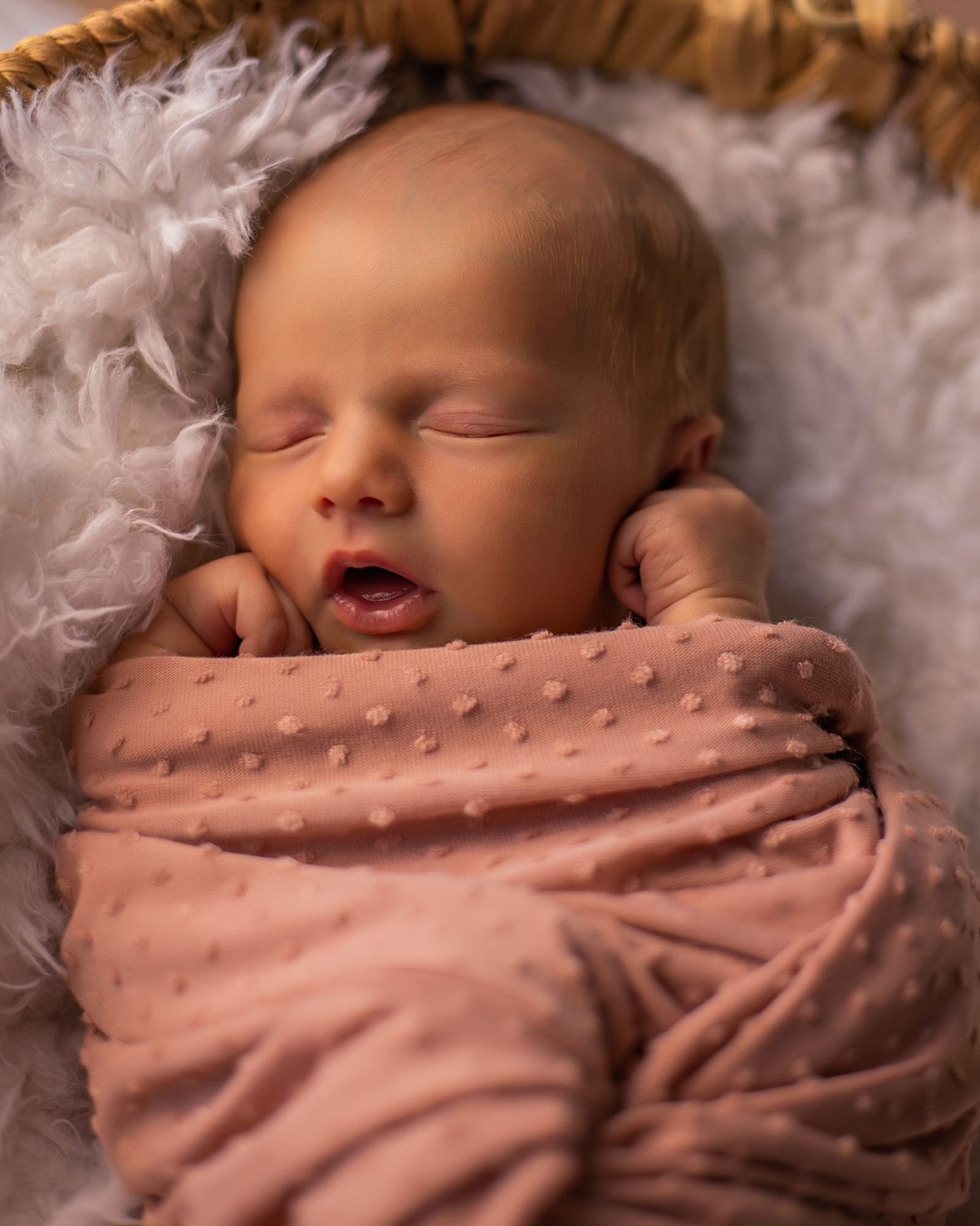 Newborn baby sleeping in a basket by Frisco photographer Britt Sheafe