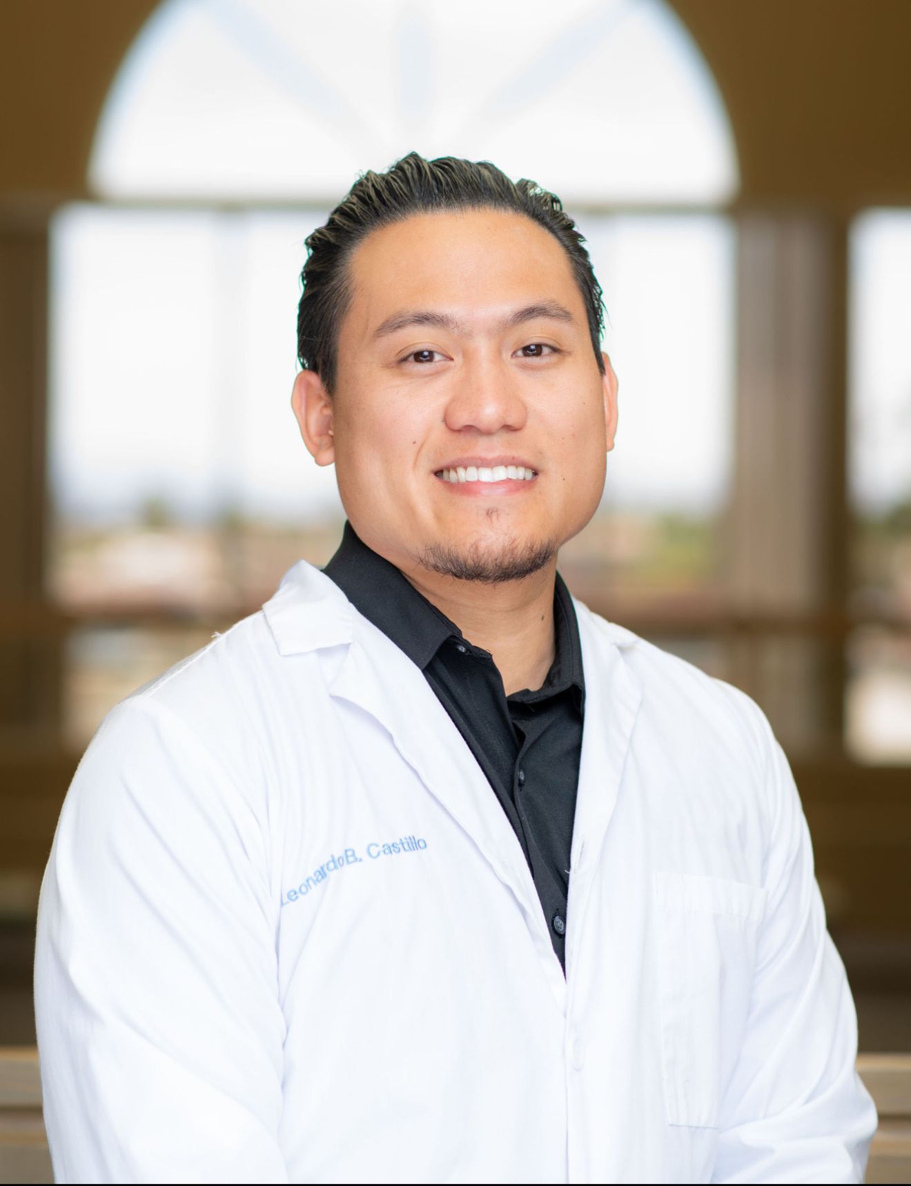 Professional headshots of a person in a white coat against a brown background.