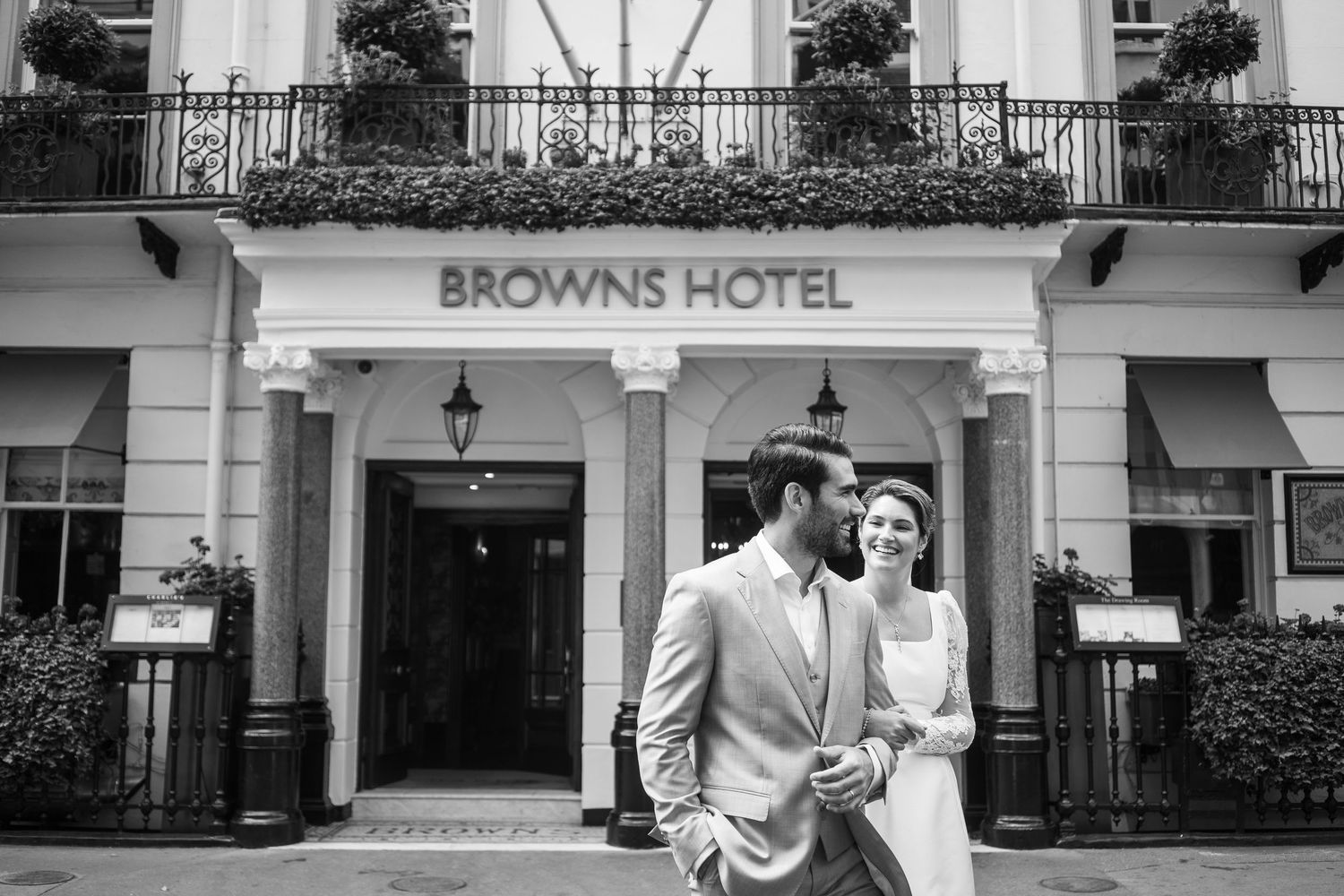 Exterior view of Luxury Hotel with white columns and classic architecture.