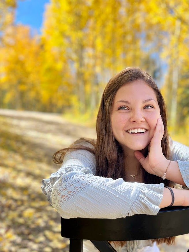 girl sitting on chair smiling