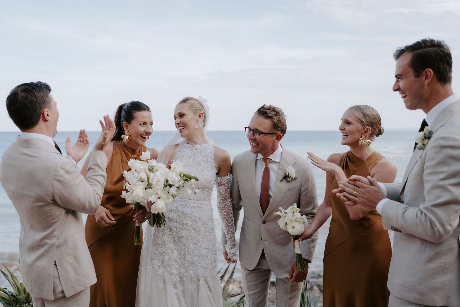 bride and groom and bridal party laughing at amante ibiza