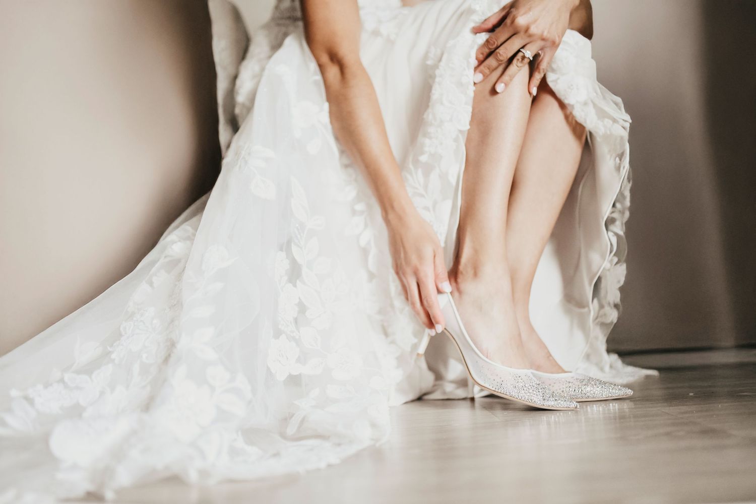 Bride putting on earrings before ceremony at D’Vine Grace