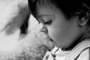 A series of black and white close-up portraits showing different emotional expressions.