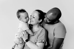A series of intimate black and white photos showing tender moments between parents and babies.