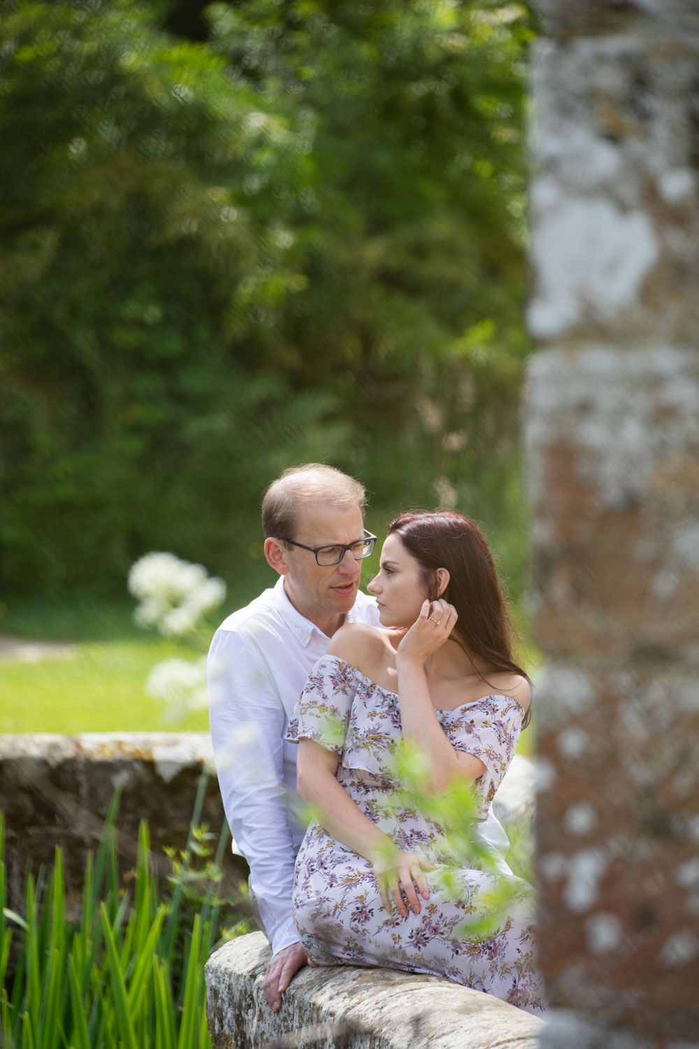 Kent castle with romantic couple sitting by moat