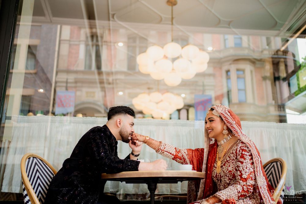 Elegant wedding celebration at a luxurious venue with crystal chandeliers and romantic table settings.