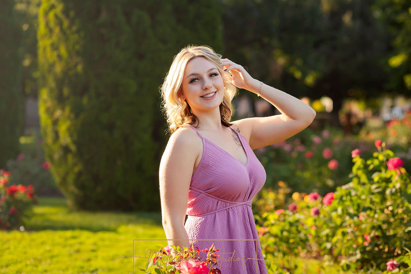 Rose Garden Julia Davis Park Boise Idaho Senior photo girl in pink dress smiling at camera