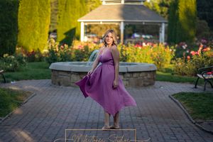 Rose Garden Julia Davis Park Boise Idaho Senior photo girl twirling in pink dress in front of fountain