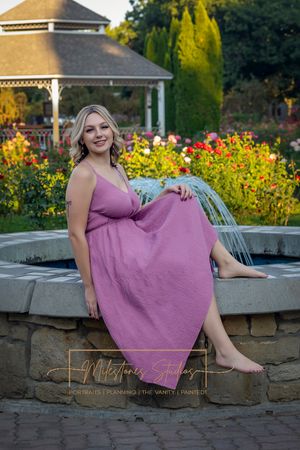 Rose Garden Julia Davis Park Boise Idaho Senior photo girl sitting on fountain ledge