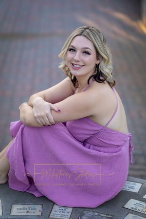Rose Garden Julia Davis Park Boise Idaho Senior photo girl sitting on fountain ledge