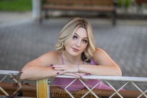 Rose Garden Julia Davis Park Boise Idaho Senior photo girl beautiful girl closeup image arms on chain link fence
