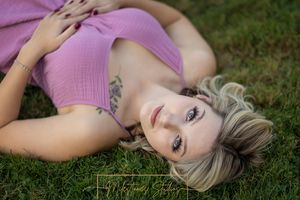 Rose Garden Julia Davis Park Boise Idaho Senior photo girl lying in grass looking at camera