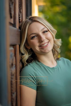 Rose Garden Julia Davis Park Boise Idaho Senior photo girl wearing green t-shirt and jeans