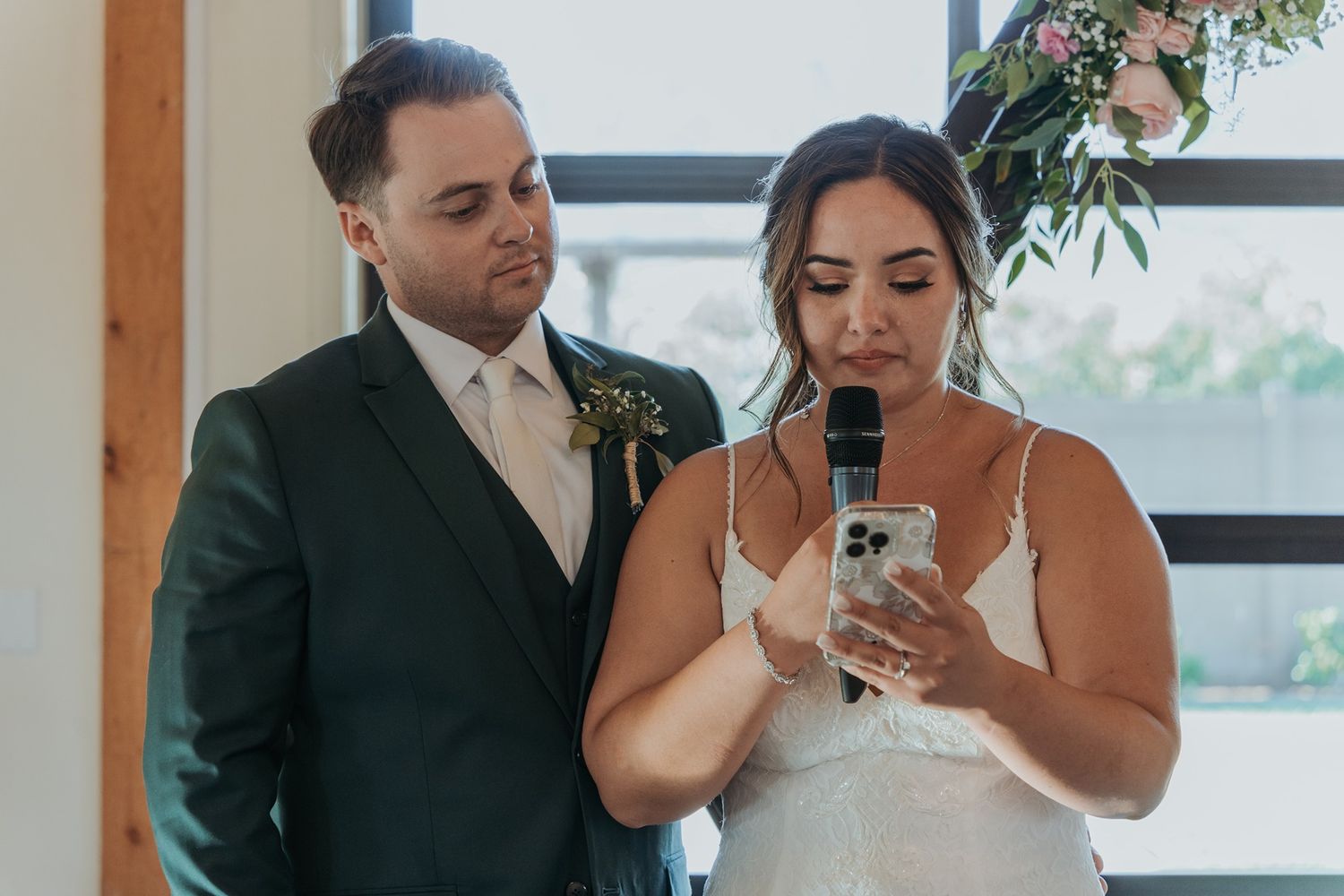 Bride and groom share a speech at an elegant indoor wedding reception at Canopy Grove by Wedgewood Weddings.