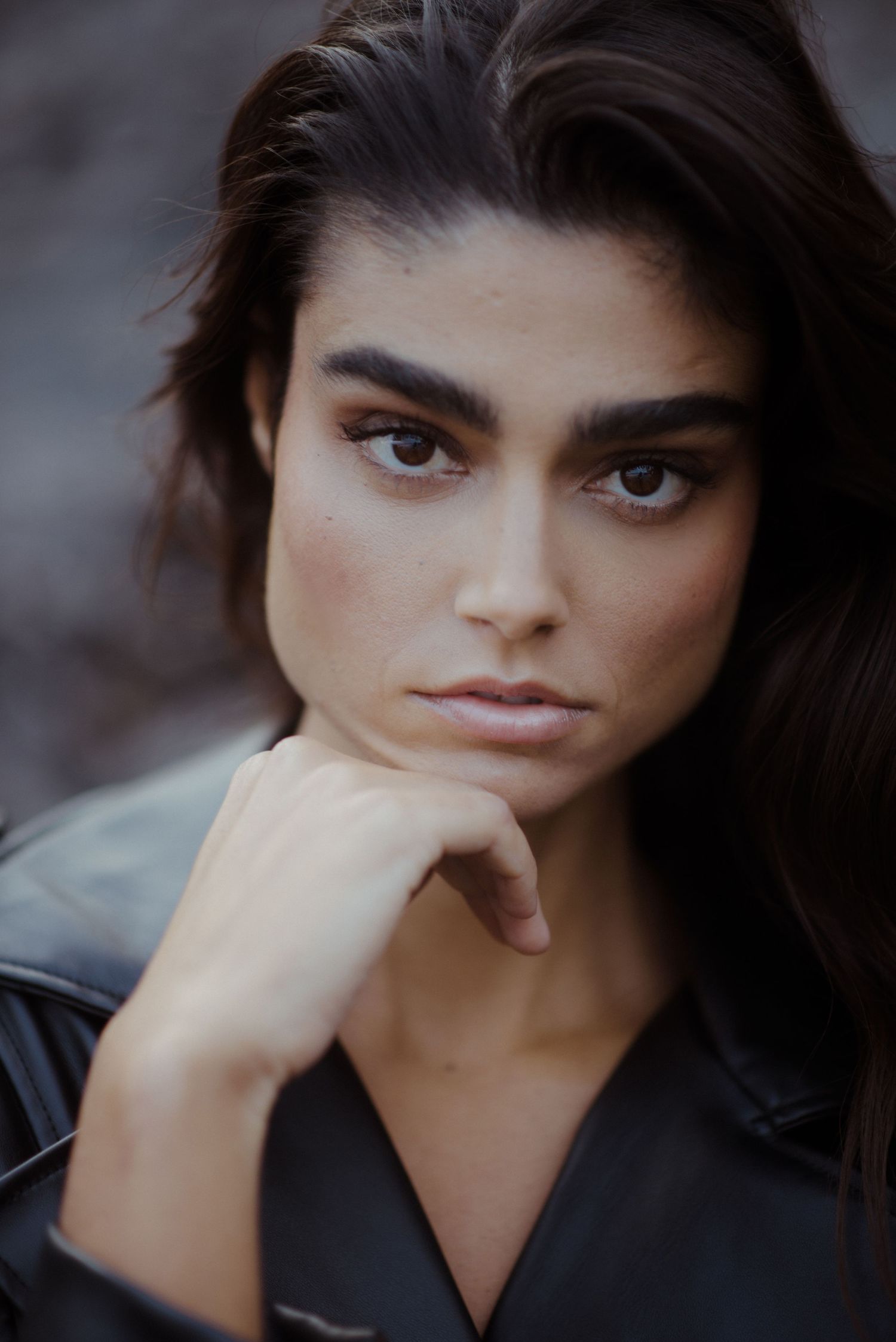 Close-up portrait series showing contemplative expressions with dark hair and dramatic lighting.